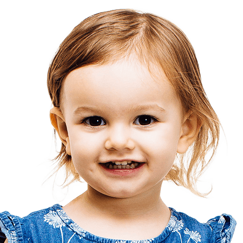 Young child with short hair smiling gently, showing confidence and friendliness.