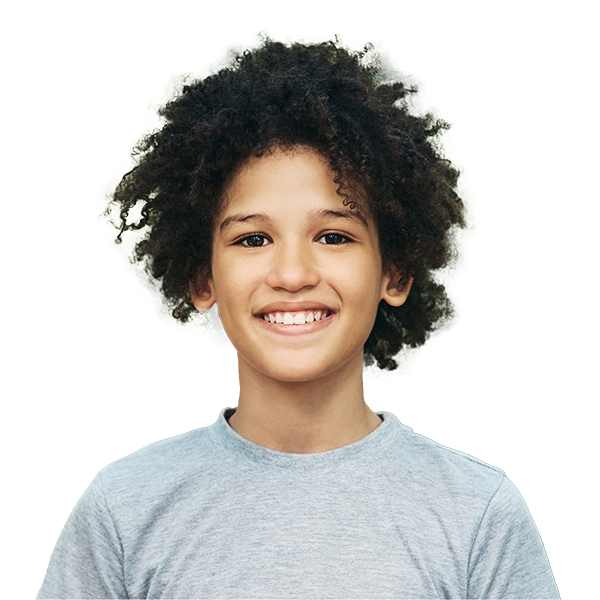 Smiling older child with curly hair, showing confidence and a friendly personality.